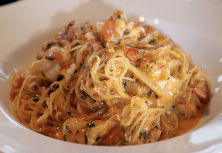 Contessa signature dishes Spicy Lobster Capellini, Veal Milanese, Squash Carpaccio, Pistachio Gelato